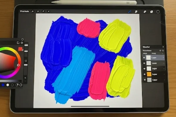 iPad with Procreate app showing digital painting techniques using vibrant brush strokes.